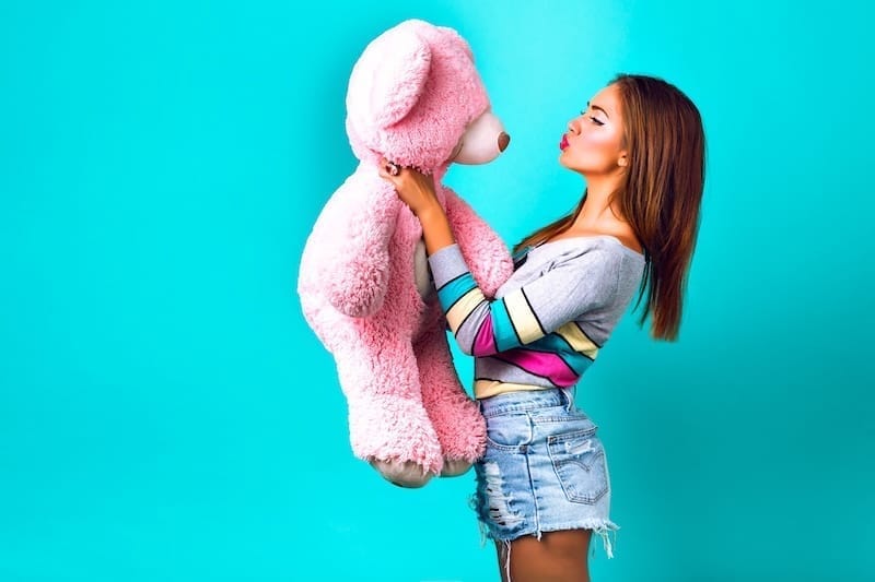 woman-posing-with-big-pink-toy-bear-2024-10-13-20-32-13-utc